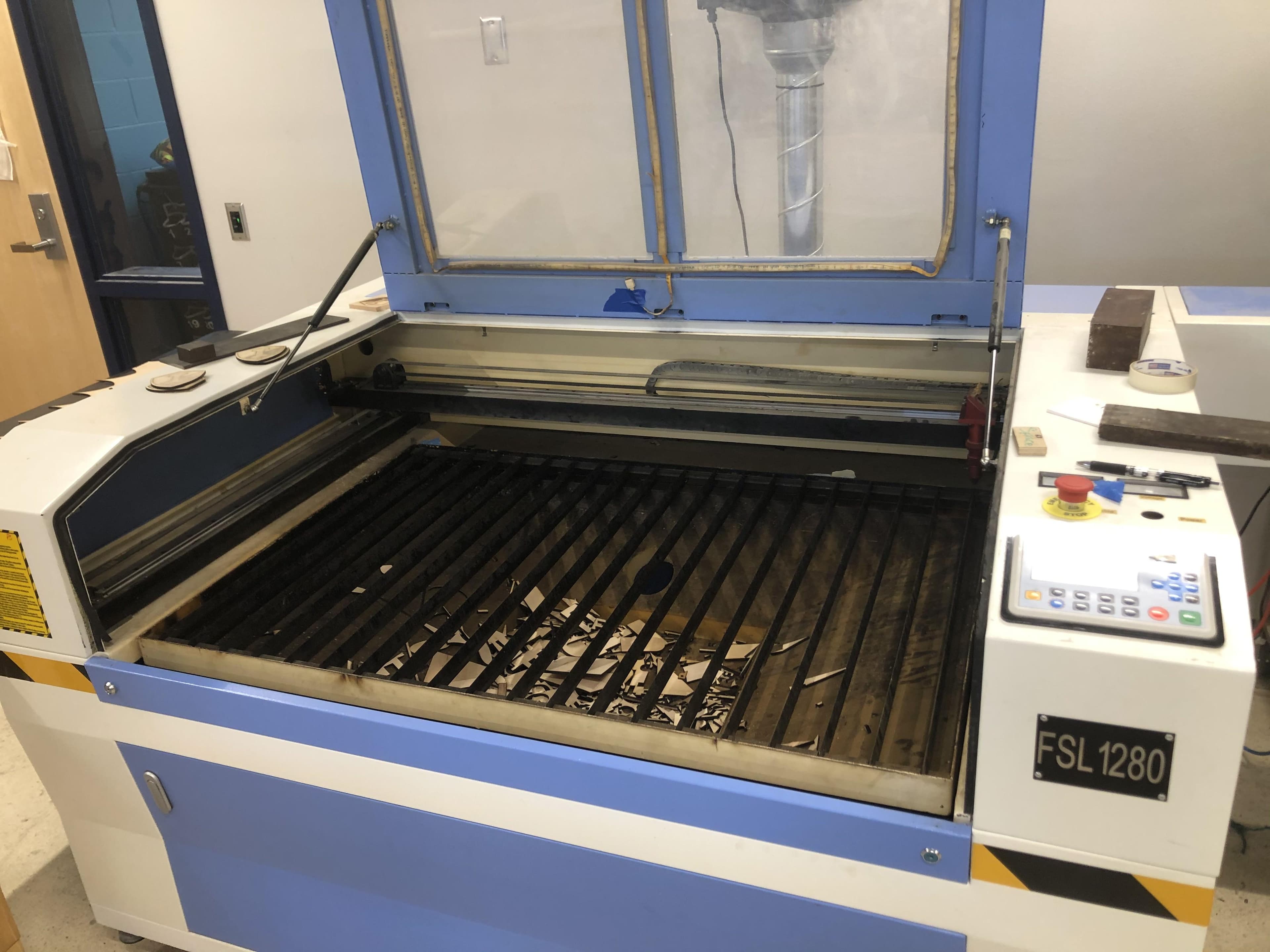 Use Our School’s CNC Machine and Laser Cutter to Engrave the Purdue Logo and Laser Cut the Chicago Skyline.