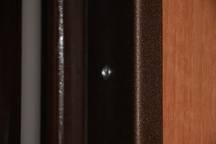Rivet on metal mounting bracket