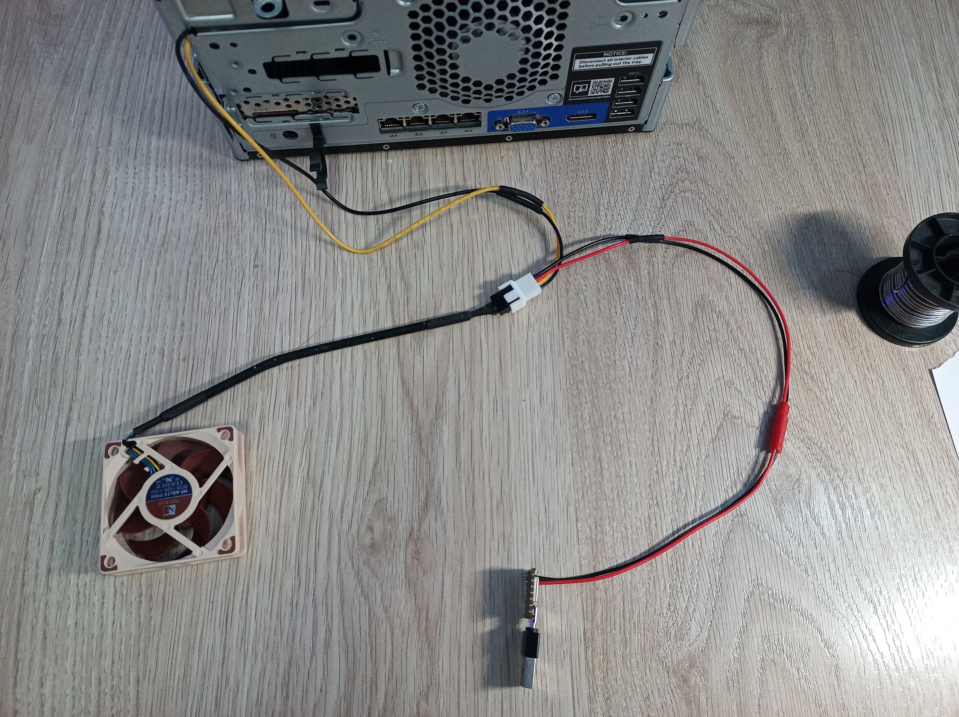 Connecting the Seeeduino microcontroller to the PWM fan and 12-volt power.