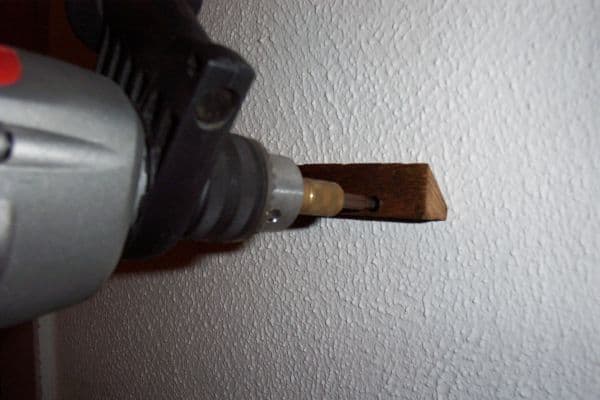 Screw the Mounting Cleat to the Wall.