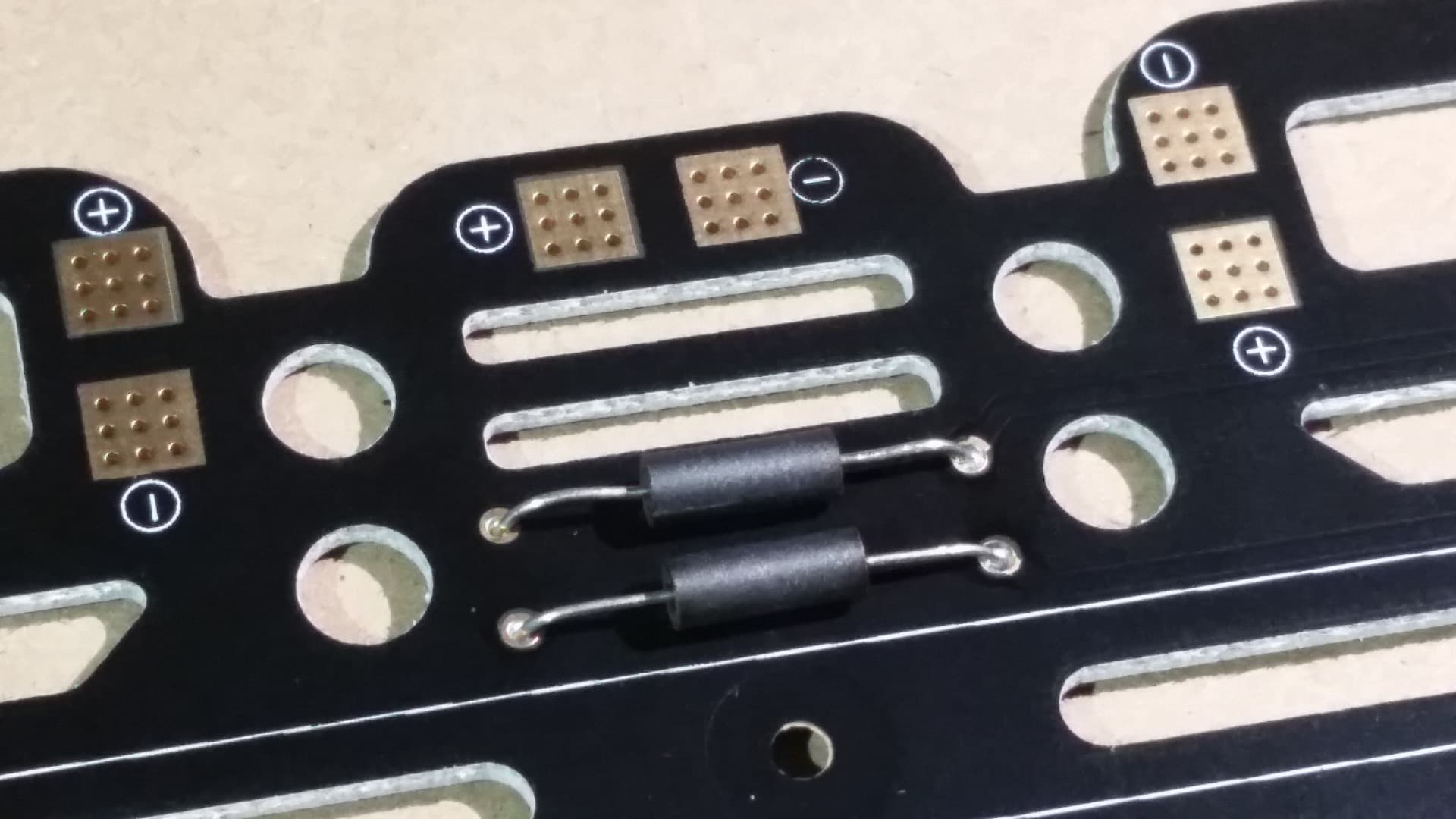 Solder Ferrite Beads to the Power Distribution Board