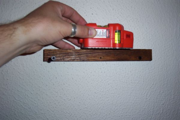 Screw the Mounting Cleat to the Wall.