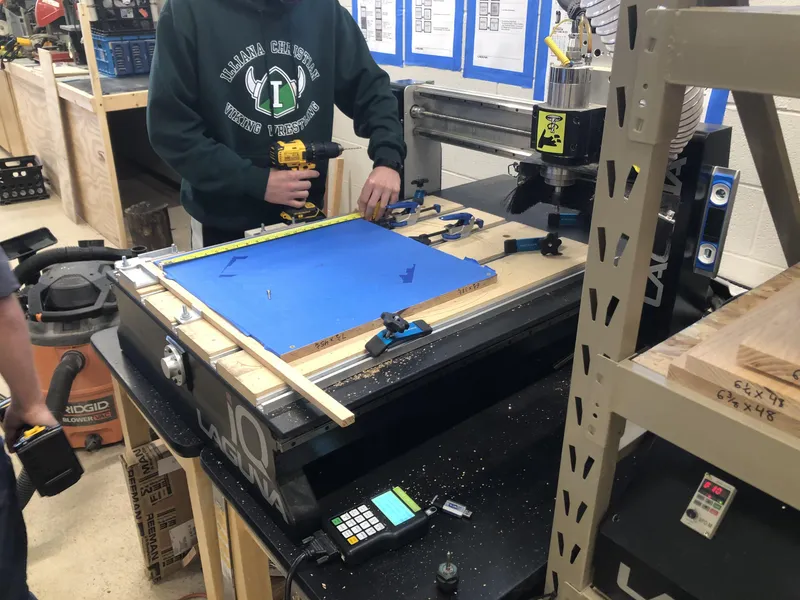 Use Our School’s CNC Machine and Laser Cutter to Engrave the Purdue Logo and Laser Cut the Chicago Skyline.