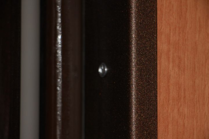 Rivet on metal mounting bracket
