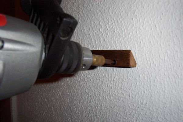 Screw the Mounting Cleat to the Wall.
