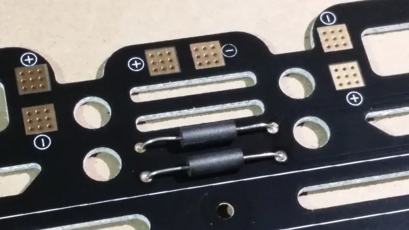 Solder Ferrite Beads to the Power Distribution Board